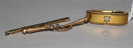 A yellow metal (18ct) diamond-set scarf clip and two yellow metal bar brooches.